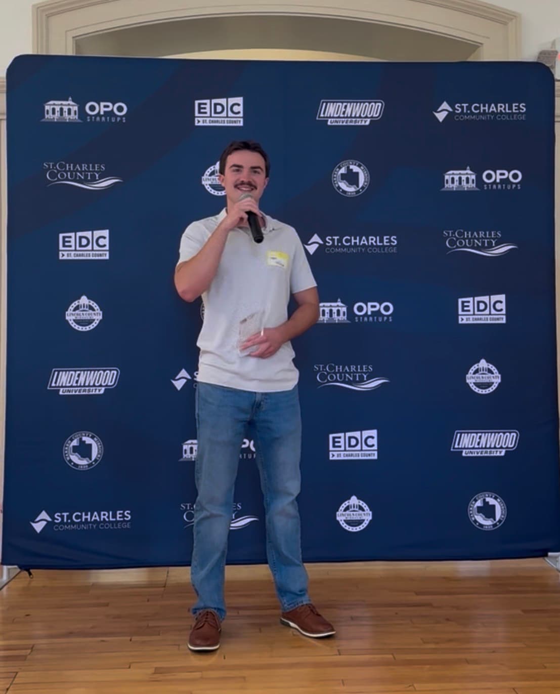 Logan LeBeau speaking at a St. Charles County entrepreneurship event